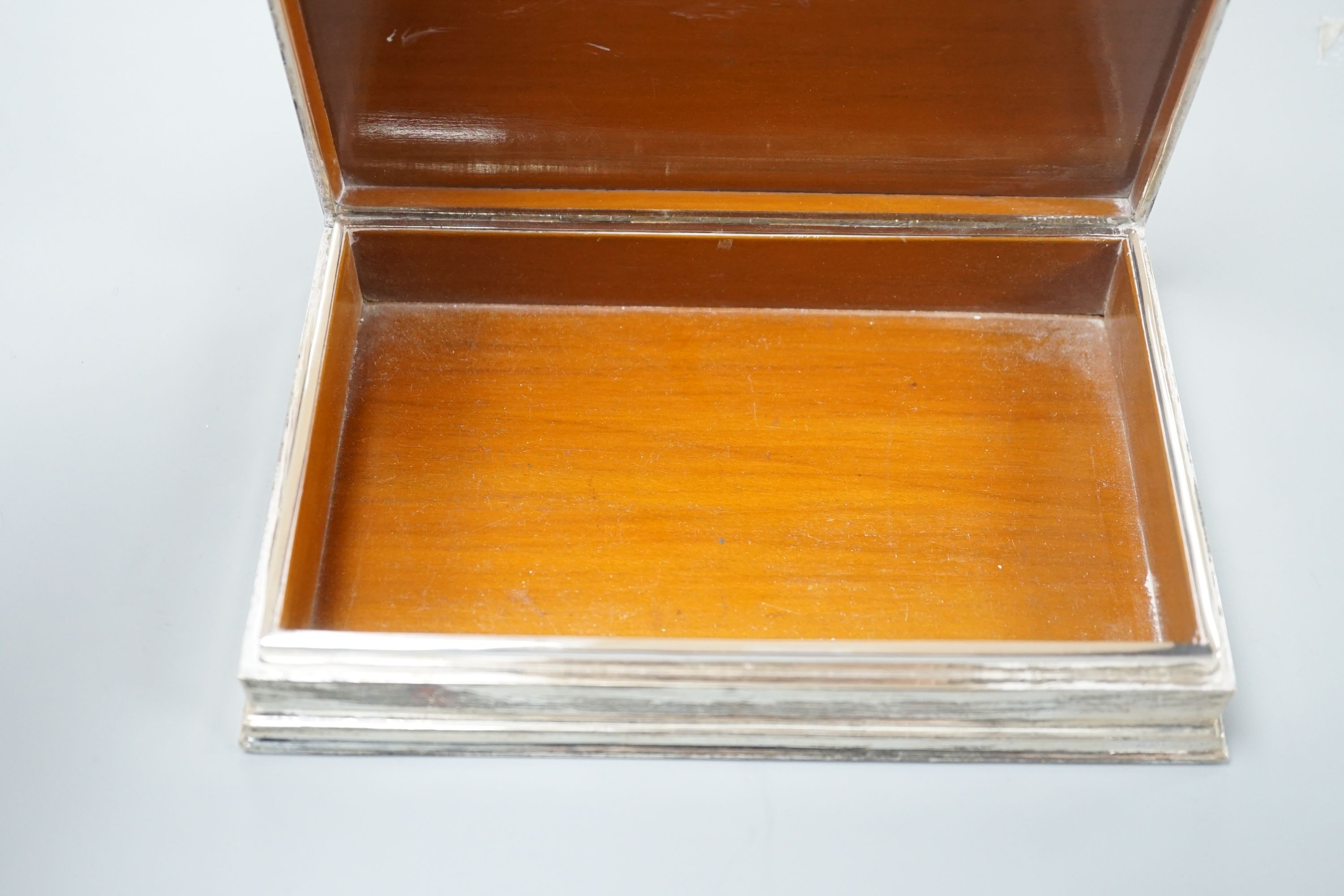 A Siamese sterling and niello cigarette box, 18.7cm.